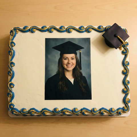 Graduation cake with portrait edible image topper, overhead view