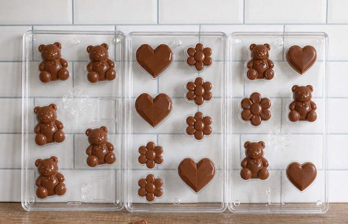 Wall of chocolate and candy molds at Gloria's